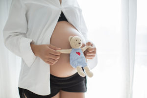 Pregnant Woman with teddy bear